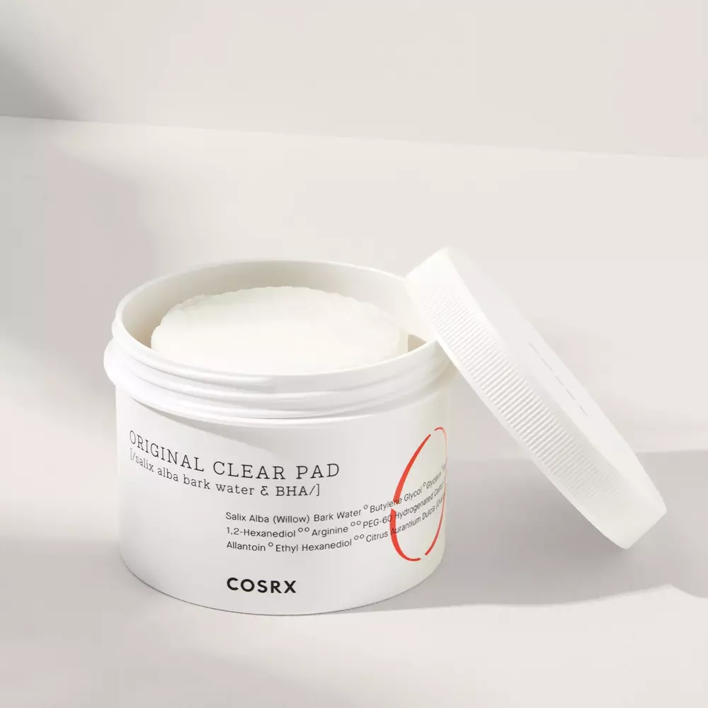 The COSRX One Step Original Clear Pad is an exfoliating and cleansing solution in pad form front pad open label