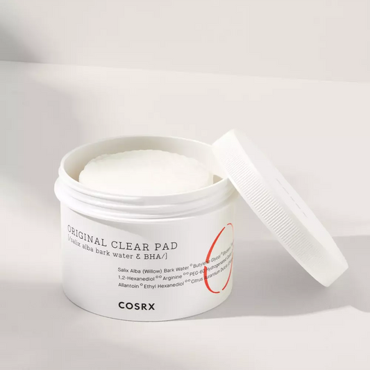 The COSRX One Step Original Clear Pad is an exfoliating and cleansing solution in pad form front pad open label